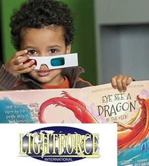 Boy with glasses reading a book with Lightforce International Logo